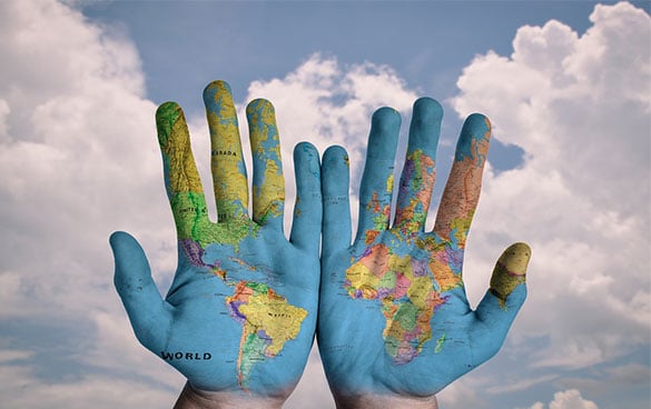 World Map Painted On Hands - Moving Overseas